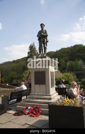 Ironbridge Shropshire England UK May People sitting out in the sunshine on seats around the town War Memorial eating ice cream Stock Photo