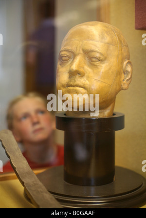 Young visitor examining the wax head of Russian tsar Peter the Great in the State Hermitage Museum in St Petersburg, Russia Stock Photo