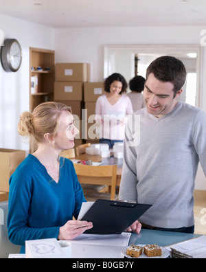 Couple running business from home Stock Photo