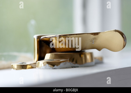 Brass plated, sash window lock. Stock Photo