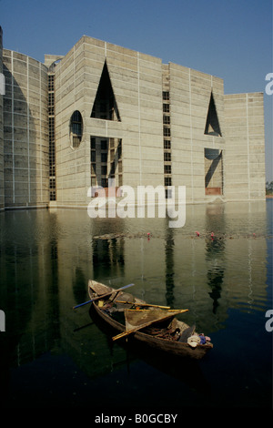 A rowboat in front of the Bangladeshi parliament building, Jatiyo Sangsad Bhaban, Dhaka, Bangladesh. Stock Photo