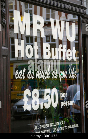 Mr Wu eat as much as you like hot buffet sign on window of Chinese restaurant in Soho London UK Stock Photo