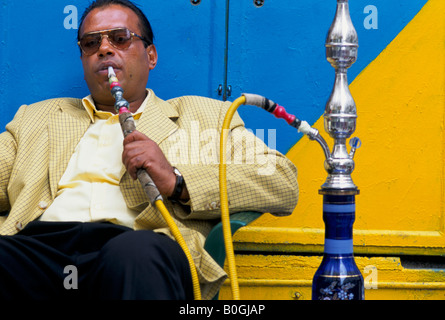 A middle-aged man sitting smoking a hookah in Tripoli, Libya. Stock Photo