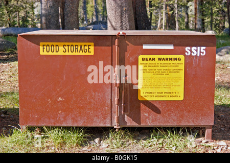 Sign warning of bear habitat on food locker Tuolumne Meadows Yosemite National Park California Stock Photo