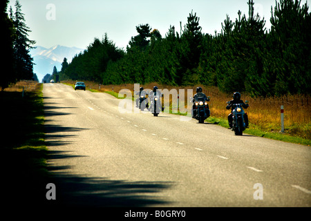 Road travel by Motorcycle New Zealand with Mt Hutt in background Stock Photo