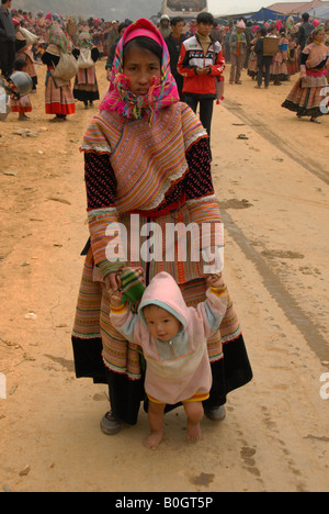 flower hmong girl with her baby at bac ha saturday market Stock Photo