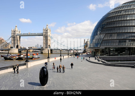 London city hall mayor office paved promenade Tower Bridge River Thames Canary Wharf and docklands distant Stock Photo