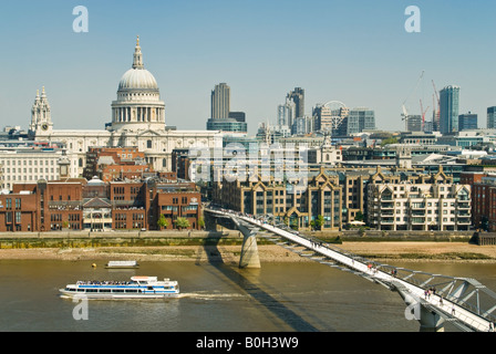 Horizontal aerial view over London of St Paul's Cathedral and the Millennium Bridge (aka Wobbly Bridge) on a bright sunny day. Stock Photo