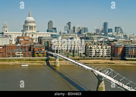 Horizontal aerial view over London of St Paul's Cathedral and the Millennium Bridge (aka Wobbly Bridge) on a bright sunny day. Stock Photo