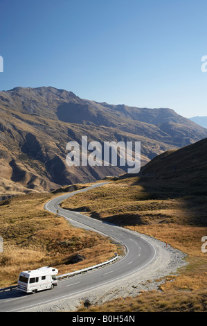 Campervan and Crown Range Road between Queenstown and Wanaka South Island New Zealand Stock Photo