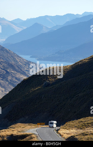 Campervan and Crown Range Road between Queenstown and Wanaka South Island New Zealand Stock Photo