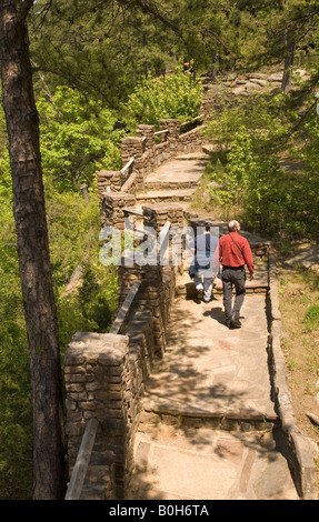 Caucasian Couple (40-45) Walk along Trail by Cedar Creek Falls Overlook at Petit Jean State Park Arkansas USA Stock Photo