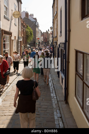 Shoppers and tourists in the narrow streets of Whitby Yorkshire Stock Photo