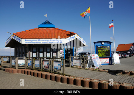 Two flags flying before the ferry ticket kiosk at Hoernum Harbour on the North Frisian island of Sylt, Schleswig-Holstein, Germ Stock Photo
