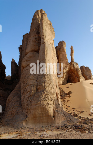 Rock formations rising out of desert sand in Tin Akachaker, Tassili du Hoggar, Wilaya Tamanrasset, Algeria, North Africa Stock Photo