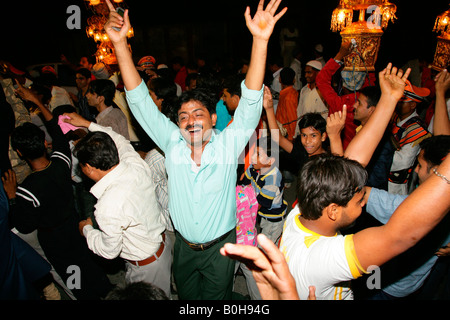 Guests dancing during a wedding held at a Sufi shrine in Bareilly, Uttar Pradesh, India, Asia Stock Photo