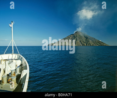 Stromboli Island viewed from a ferry, volcano, eruption, clouds of ash, Aeolian Islands, Sicily, Italy Stock Photo