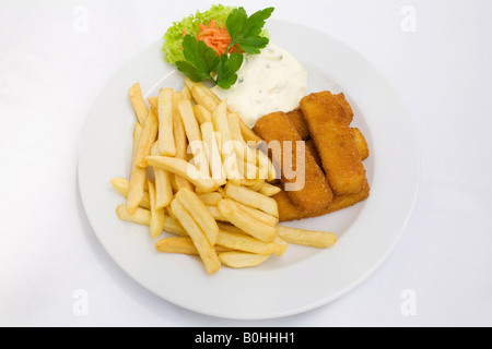 Fish sticks, tartar sauce and french fries served on a white plate Stock Photo