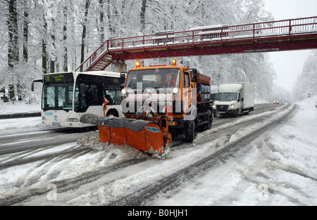 Snow plow clearing Highway B327 after a winter blizzard between Koblenz and Waldesch, Rhineland-Palatinate, Germany Stock Photo