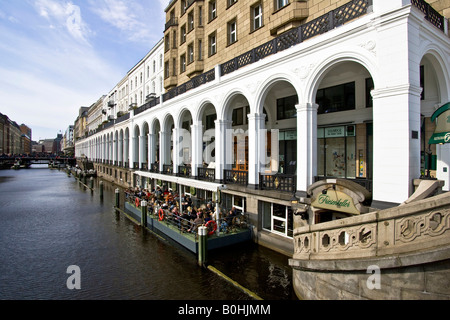 Restaurant on a floating pontoon on the Alster River and the Alsterarkaden arcades, Hamburg, Germany Stock Photo