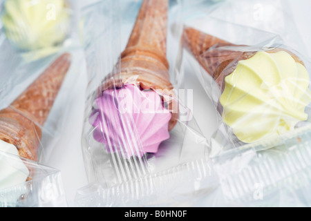 Marshmallow waffles in the shape of soft serve ice creams in various colours Stock Photo