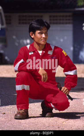 Asian man in overalls. Stock Photo