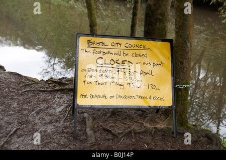 warning sign of work being carried out on a footpath showing times Vassalls Bristol UK Stock Photo