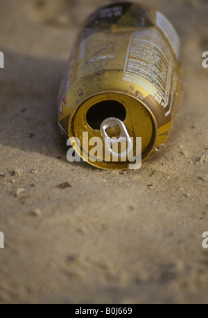 Beach litter empty been can on sand Stock Photo