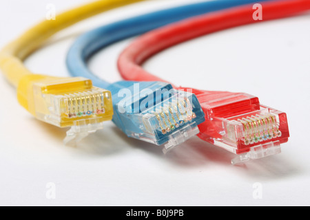 Category 5 network cables isolated on white three different colors red blue and yellow Stock Photo