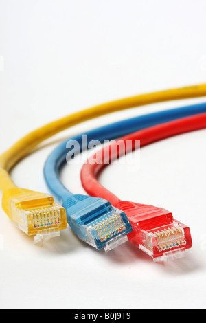 Category 5 network cables isolated on white three different colors red blue and yellow Stock Photo