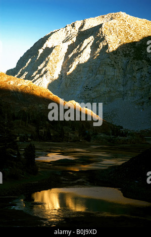 Mountain and creek bed highlighted by the setting sun at Yosemite National Park, California Stock Photo