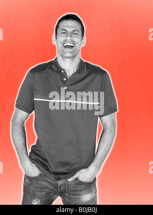 Man smiling in black and white on red background Stock Photo