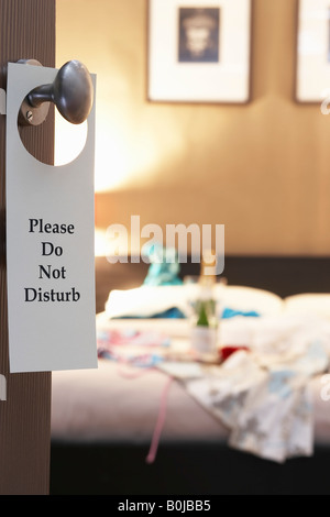 Do Not Disturb'' sign on hotel room's door Stock Photo