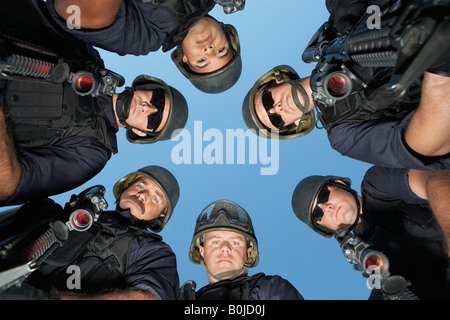 Group portrait of Swat officers standing in circle Stock Photo