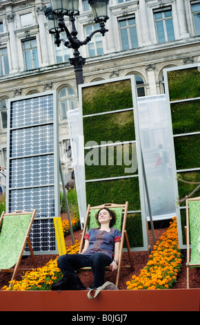 Paris France, Public Events "Garden Festival" chair idyllic Woman Sitting alone, in Lounge Chair near Solar Energy Panels Stock Photo