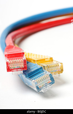 Category 5 network cables isolated on white three different colors red blue and yellow Stock Photo