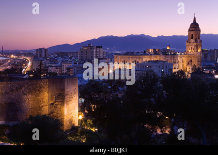 Malaga City, Spain. Cathedral and walls of Alcazaba, sunset Stock Photo