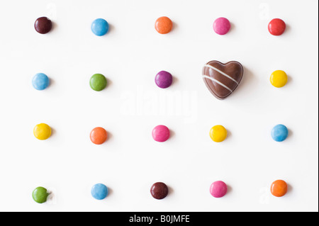 Smarties and a chocolate heart Stock Photo
