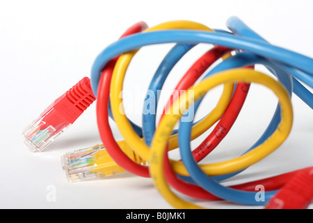 Category 5 network cables isolated on white three different colors red blue and yellow Stock Photo