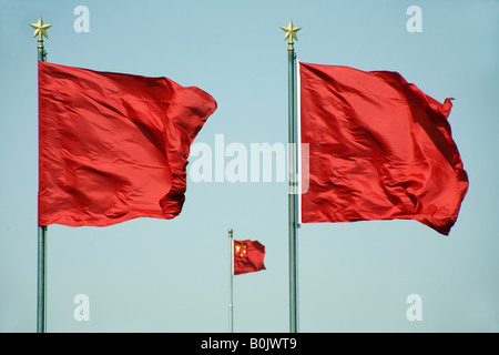 Red flags of the People's Republic of China blow energetically in the wind in Tiananmen Square, Beijing. Stock Photo