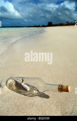 Message in a bottle on beach Stock Photo