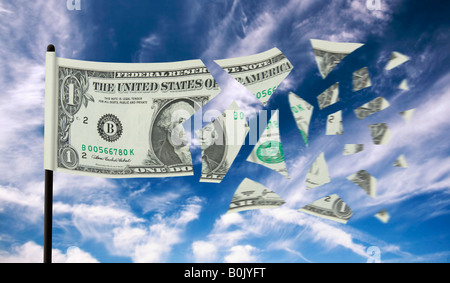 A one dollar bill tearing apart in the wind Concept of the value of the Dollar currency falling Stock Photo