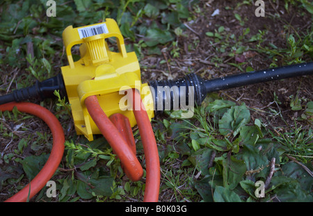 heavy duty extension cord on the ground Stock Photo