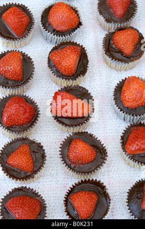Rows of chocolate and strawberry cakes Stock Photo