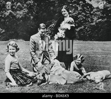 Royal family as a happy group of dog lovers, 1937.Artist: Michael Chance Stock Photo