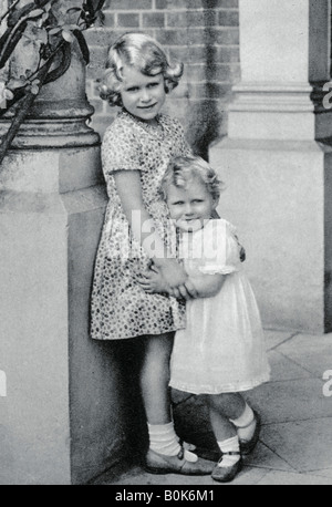 Queen Elizabeth II and Princess Margaret walk from the BOAC plane which ...