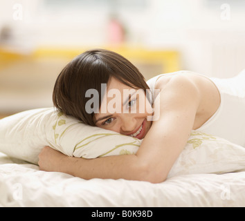 Young Woman Lying in Bed
