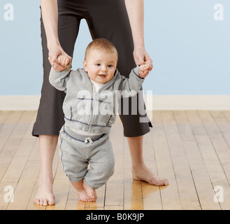 Baby Boy Learning to Walk Stock Photo