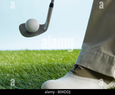 Golf Player Hitting Ball Stock Photo