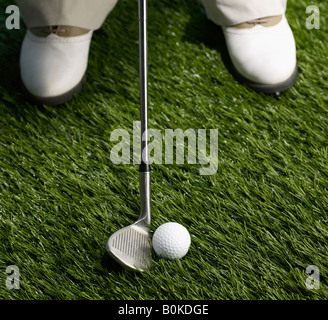 Golf Player Hitting Ball Stock Photo